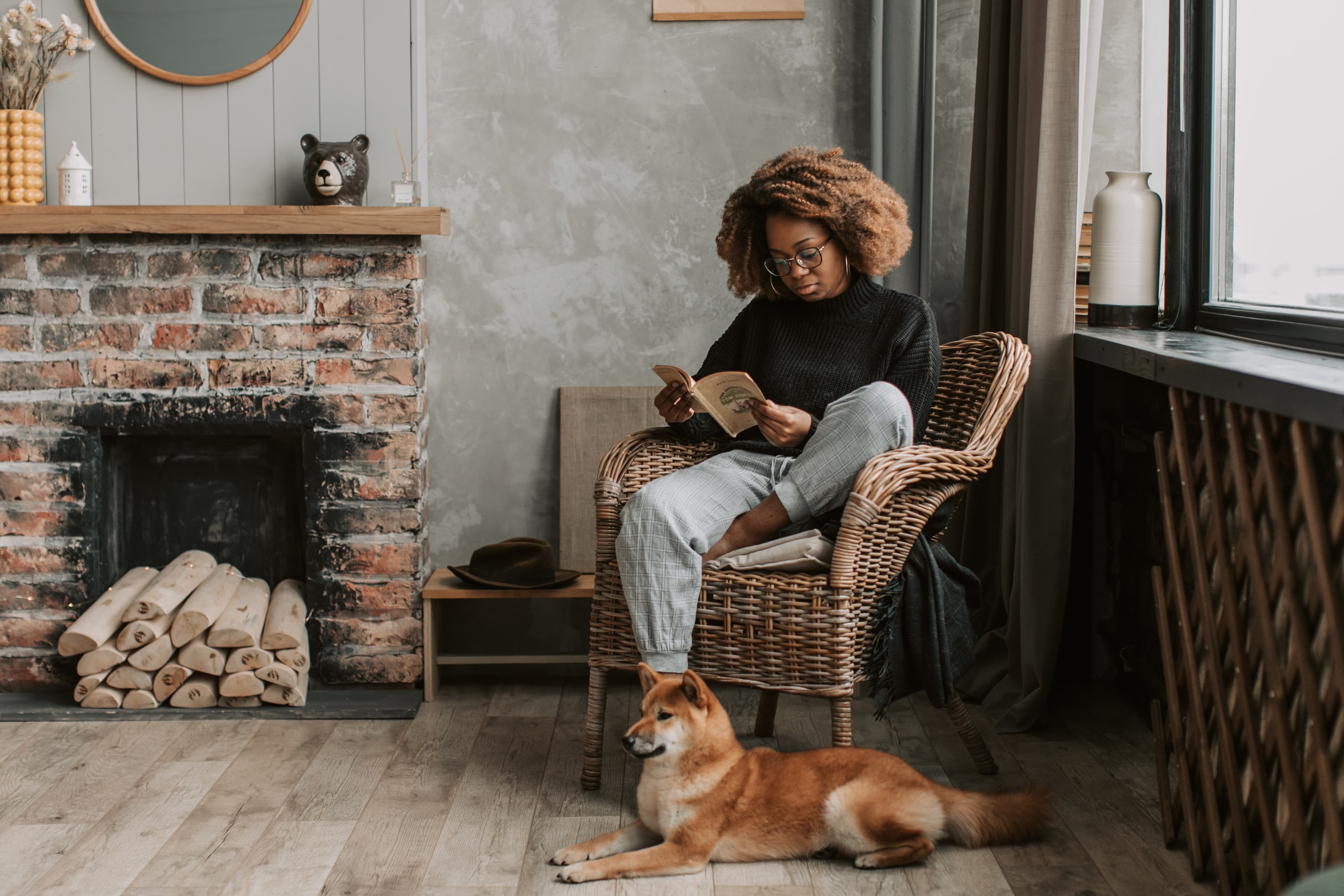 Woman reading in a chair, photo by vlada-karpovich